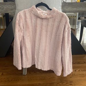 Fuzzy light pink mock neck top.